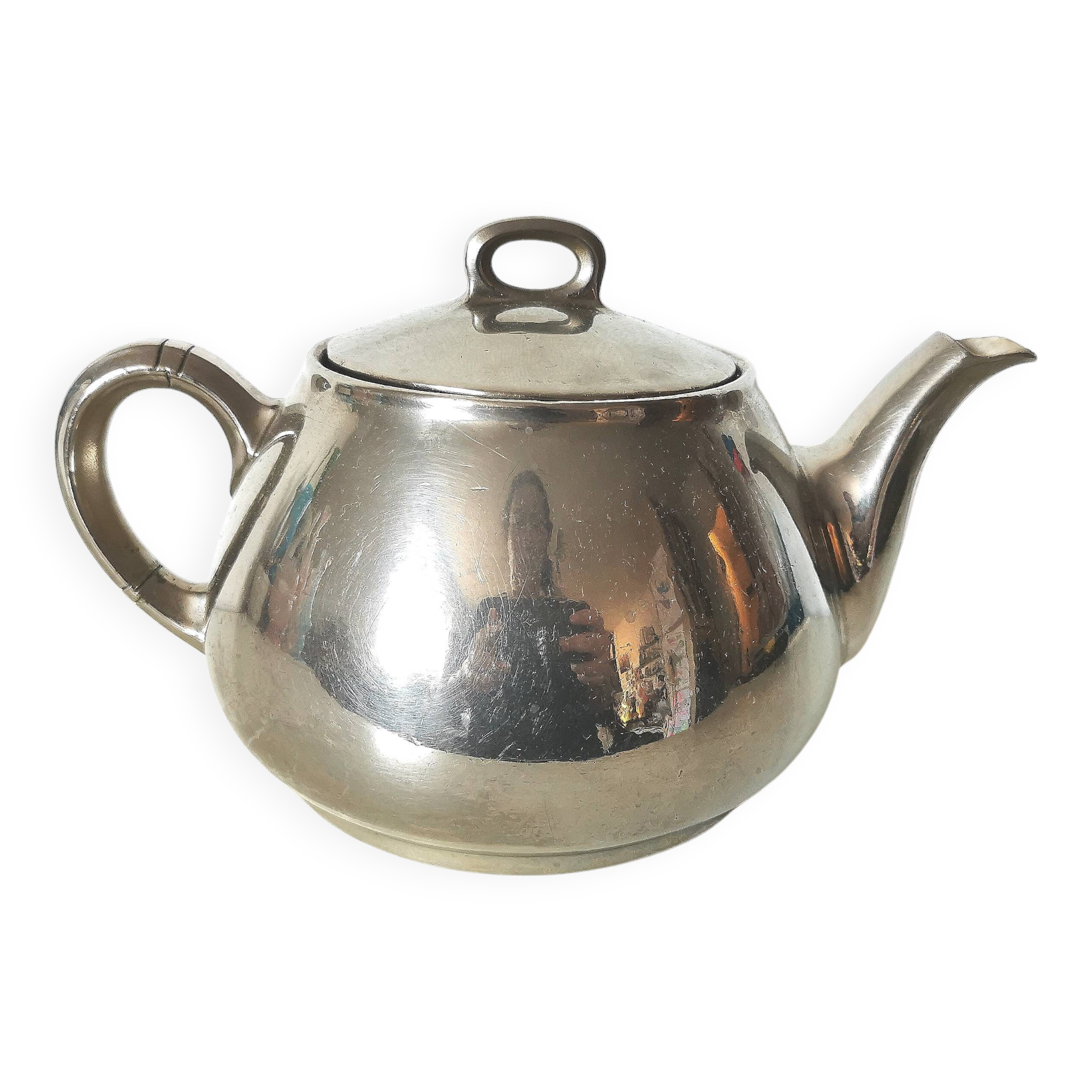 vintage teapot covered with silver metal
