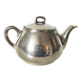 vintage teapot covered with silver metal