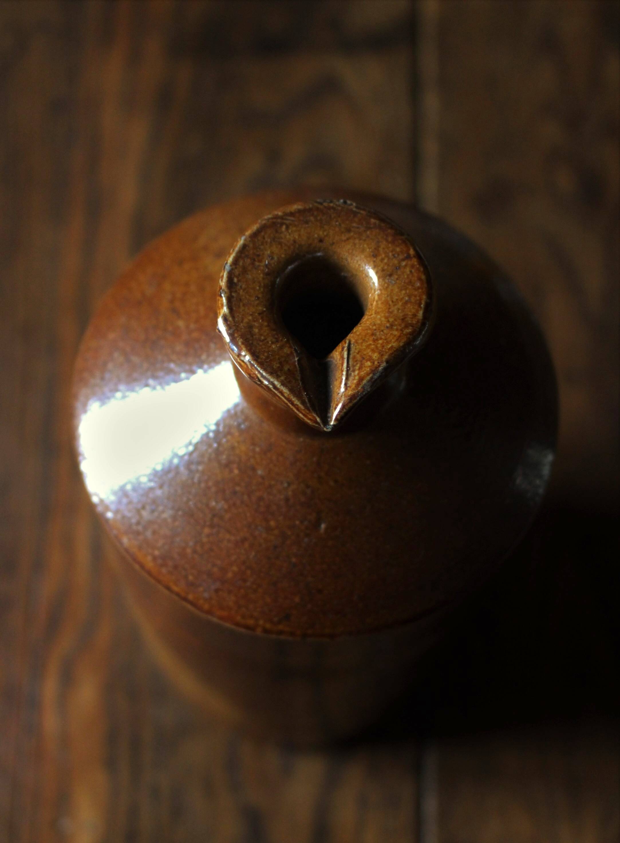 Vintage Bourne Deney stoneware liqueur bottle with pouring spout.