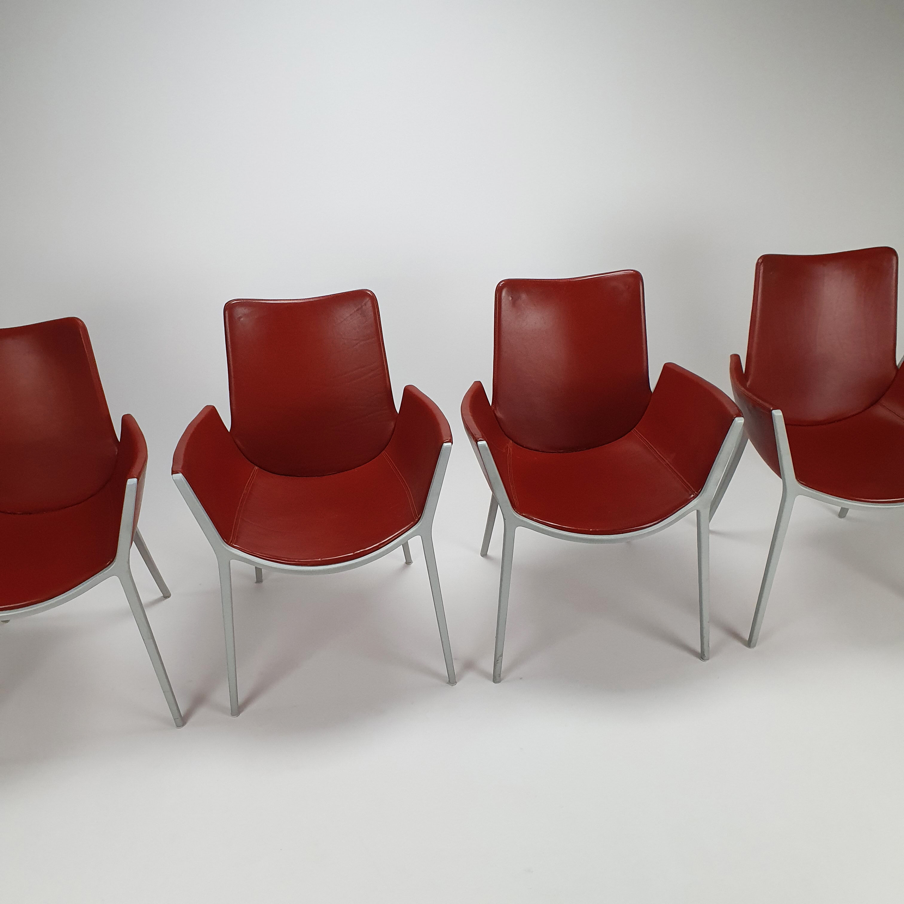 Set of 4 red leather and aluminium duna chairs by Jorge Pensi for Cassina, 1990s