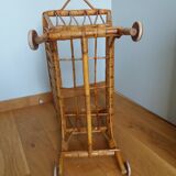 Rattan wicker cradle on wooden wheels