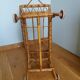 Rattan wicker cradle on wooden wheels