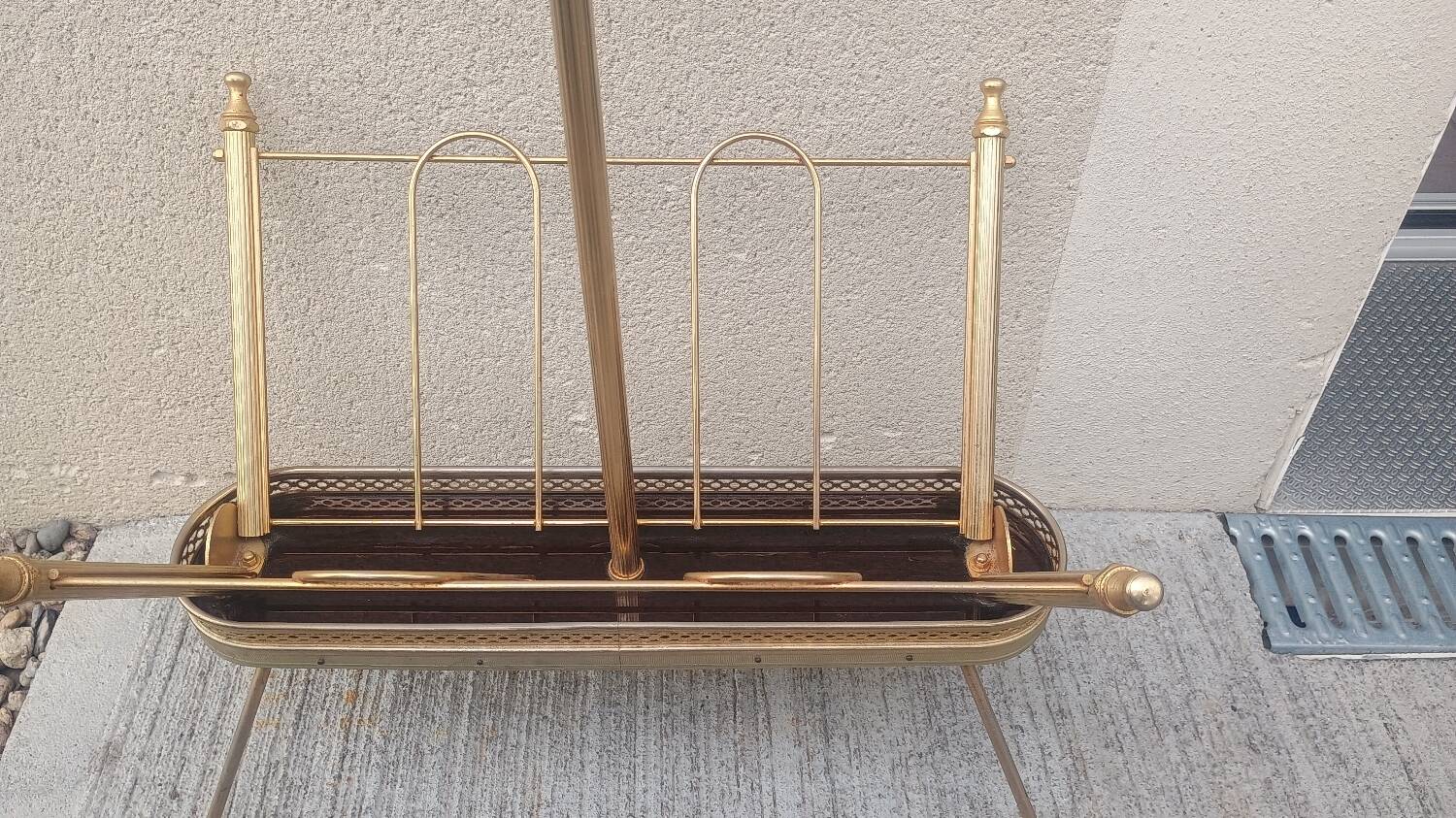 1960s brass folding magazine rack with lacquered wood decoration.