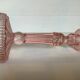 Old pink glass candlestick in Rosaline style.