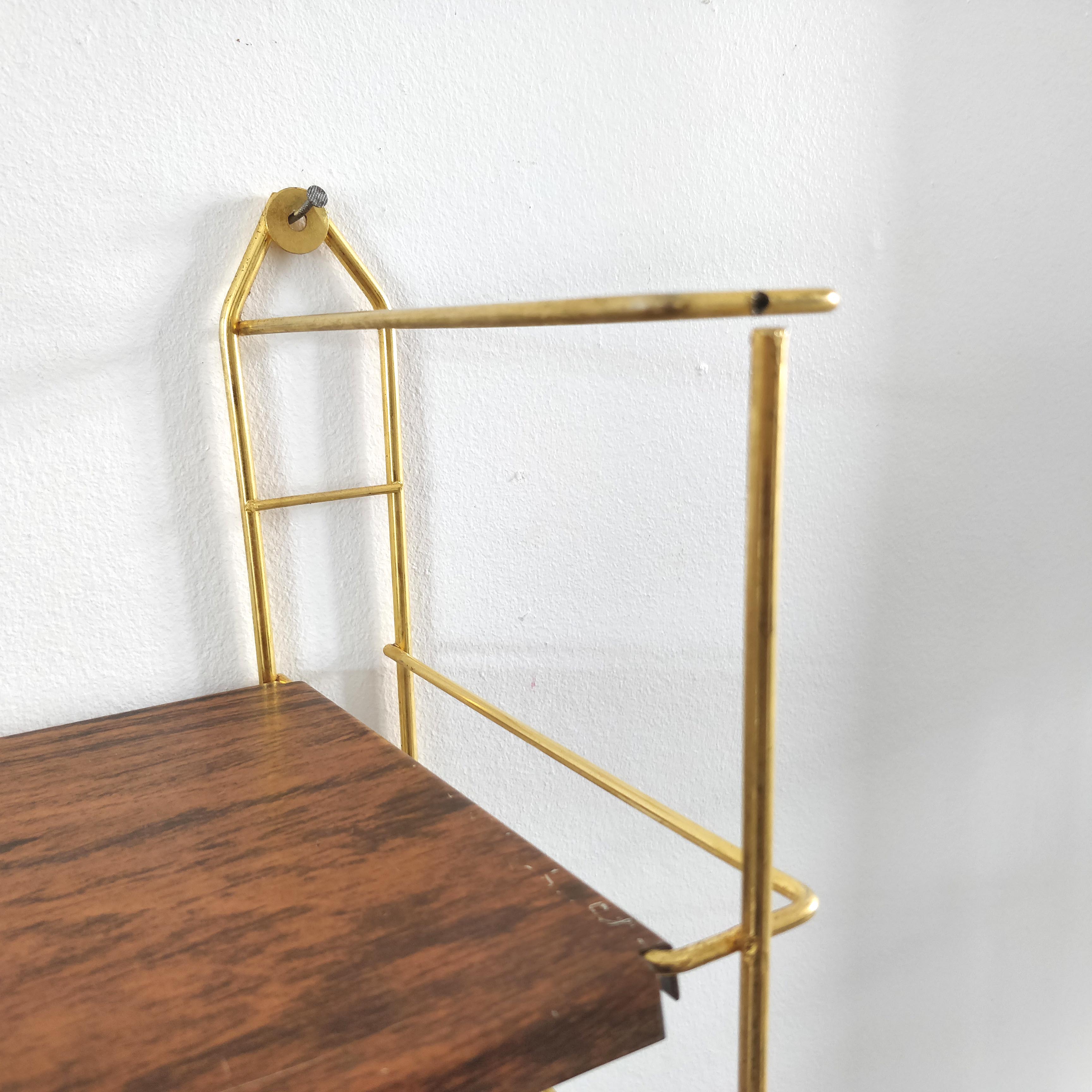 Wood-coloured metal string shelf and gold double studs 1960