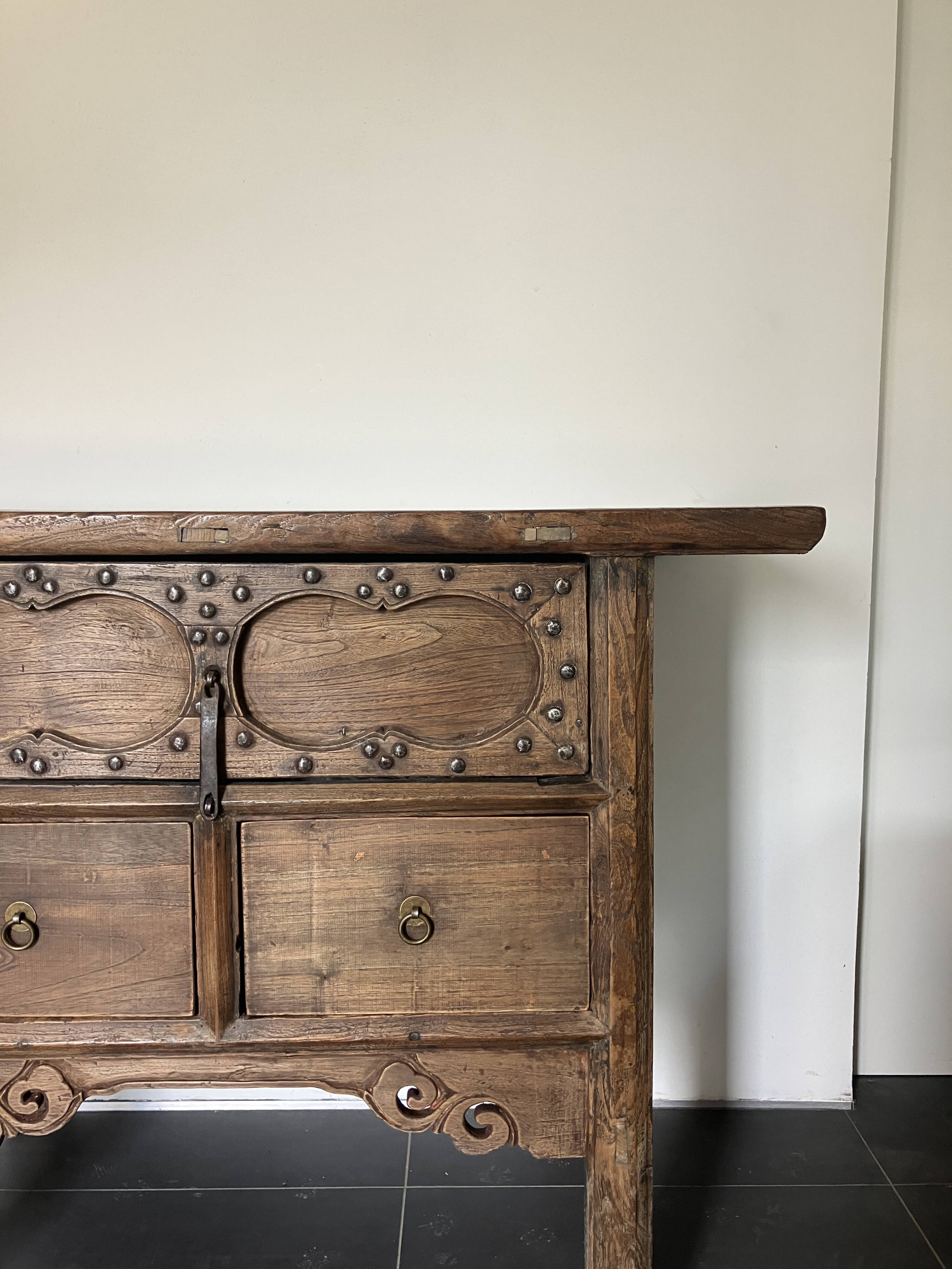 Very old elm wood with carved patterns and ironwork pieces.