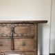 Very old elm wood with carved patterns and ironwork pieces.