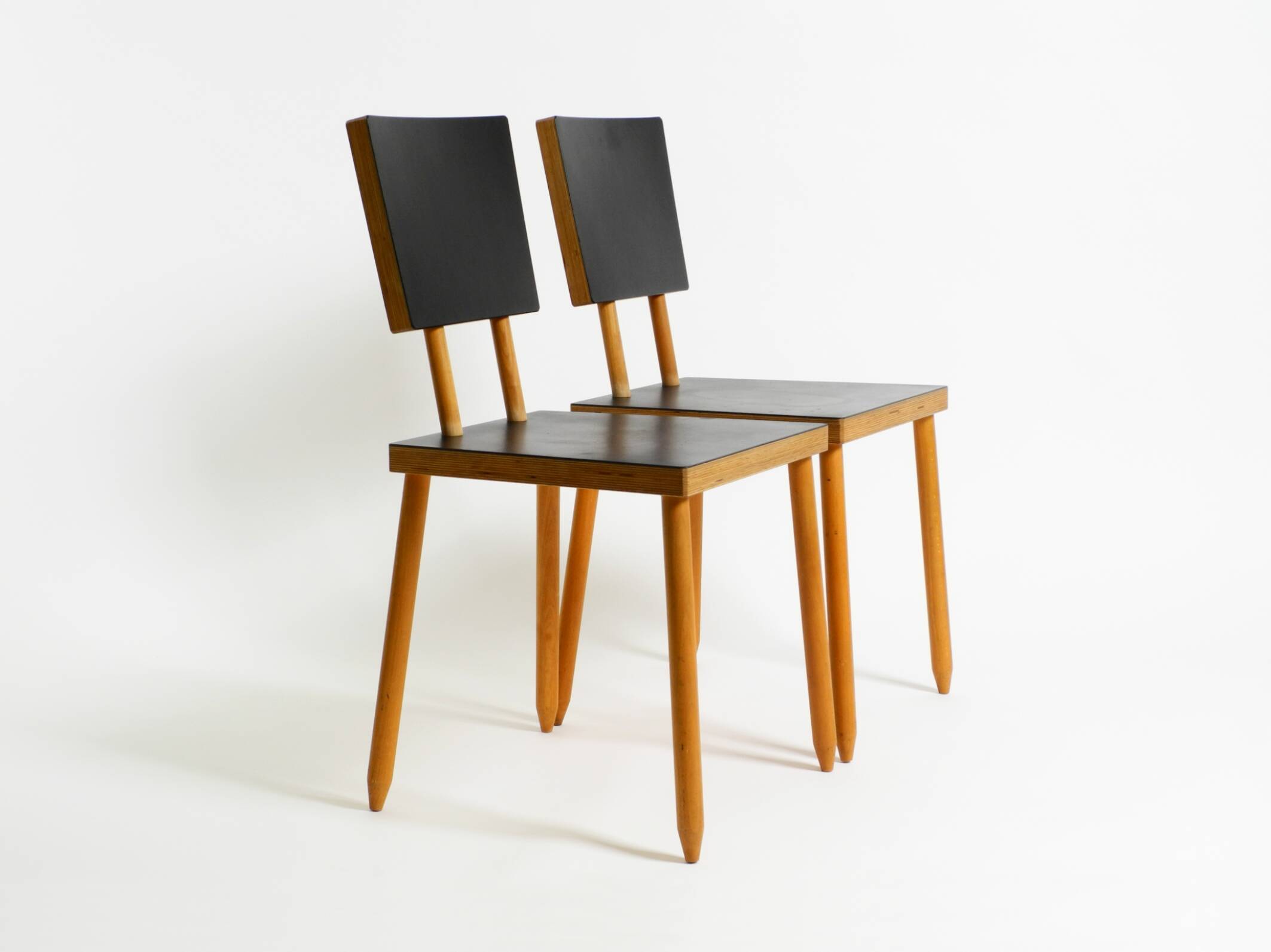 Two rare demountable plywood chairs by Axel Kufus model Stöcke for Atoll