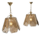 Pair of vintage pendant lights in smoked glass and gold metal, Hollywood style.