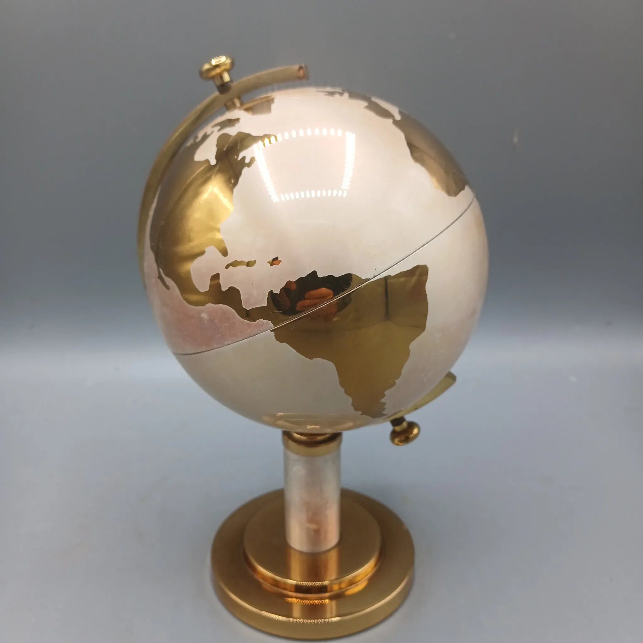Vintage brass globe cigarette dispenser