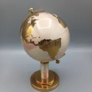 Vintage brass globe cigarette dispenser