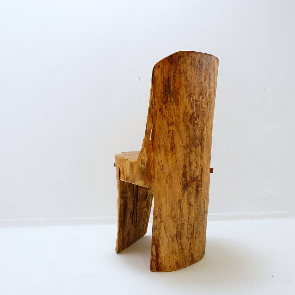 Brutalist sculptural chair in solid oak in wabi-sabi style.
