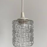 Small cylindrical molded glass pendant light