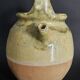 Yellow glazed terracotta gargoulette carafe with lid, early 20th century.