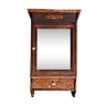 Old carved wooden medicine cabinet with beveled mirror