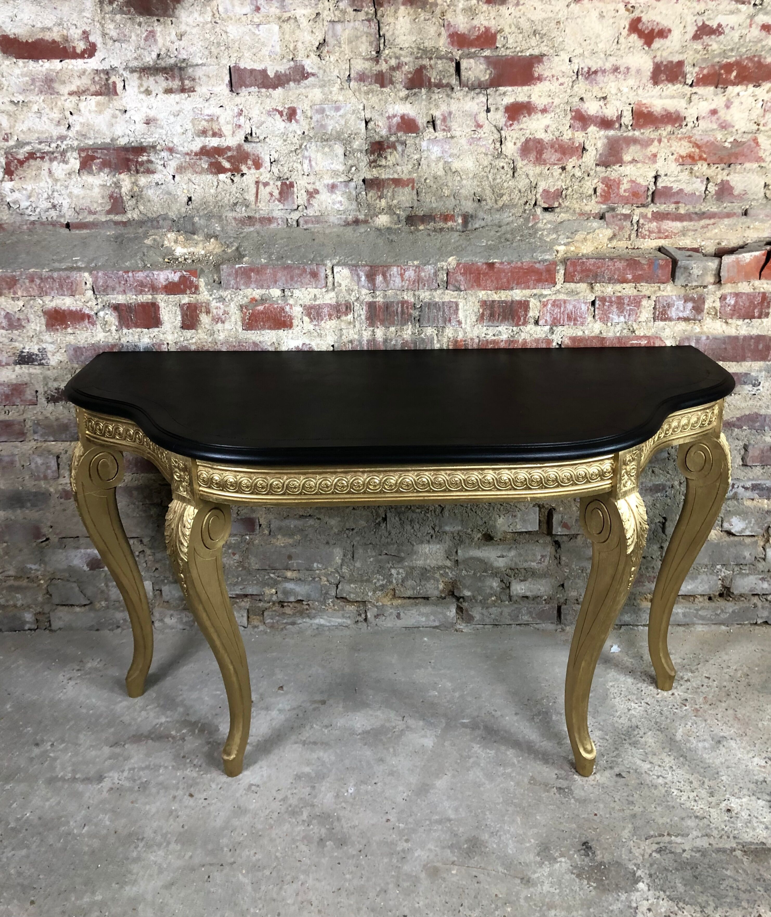 Louis XV style console in carved wood with waxed black wood top