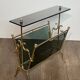 Brass magazine rack and blue-tinted glasses