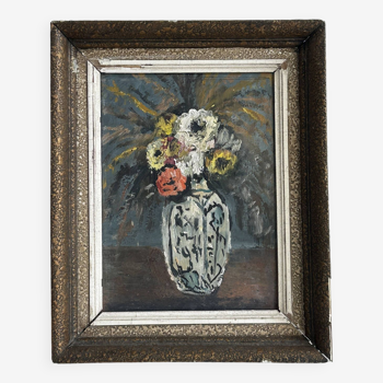 Tableau vintage de fleurs dans un vase.