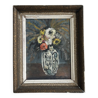 Tableau vintage de fleurs dans un vase.