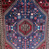 Small Persian wool rug