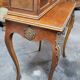 Louis XV bonheur du jour in rosewood marquetry decorated with bronze.
