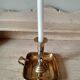 Antique metal and brass hand candle holder on rectangular base