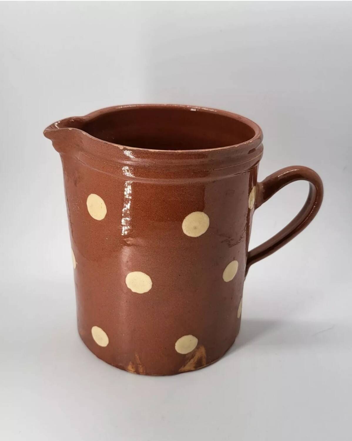 Old pitcher with polka dots savoyard pottery in glazed terracotta alsace