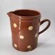 Old pitcher with polka dots savoyard pottery in glazed terracotta alsace