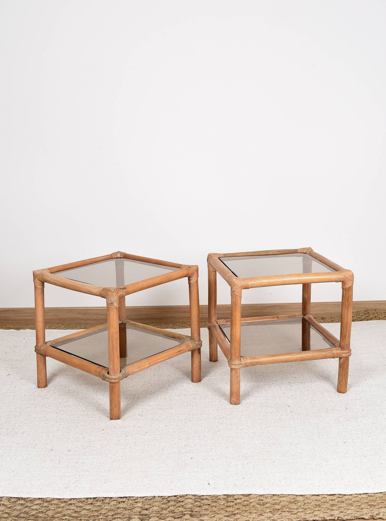 Pair of bedside tables or side tables, in rattan and smoked glass