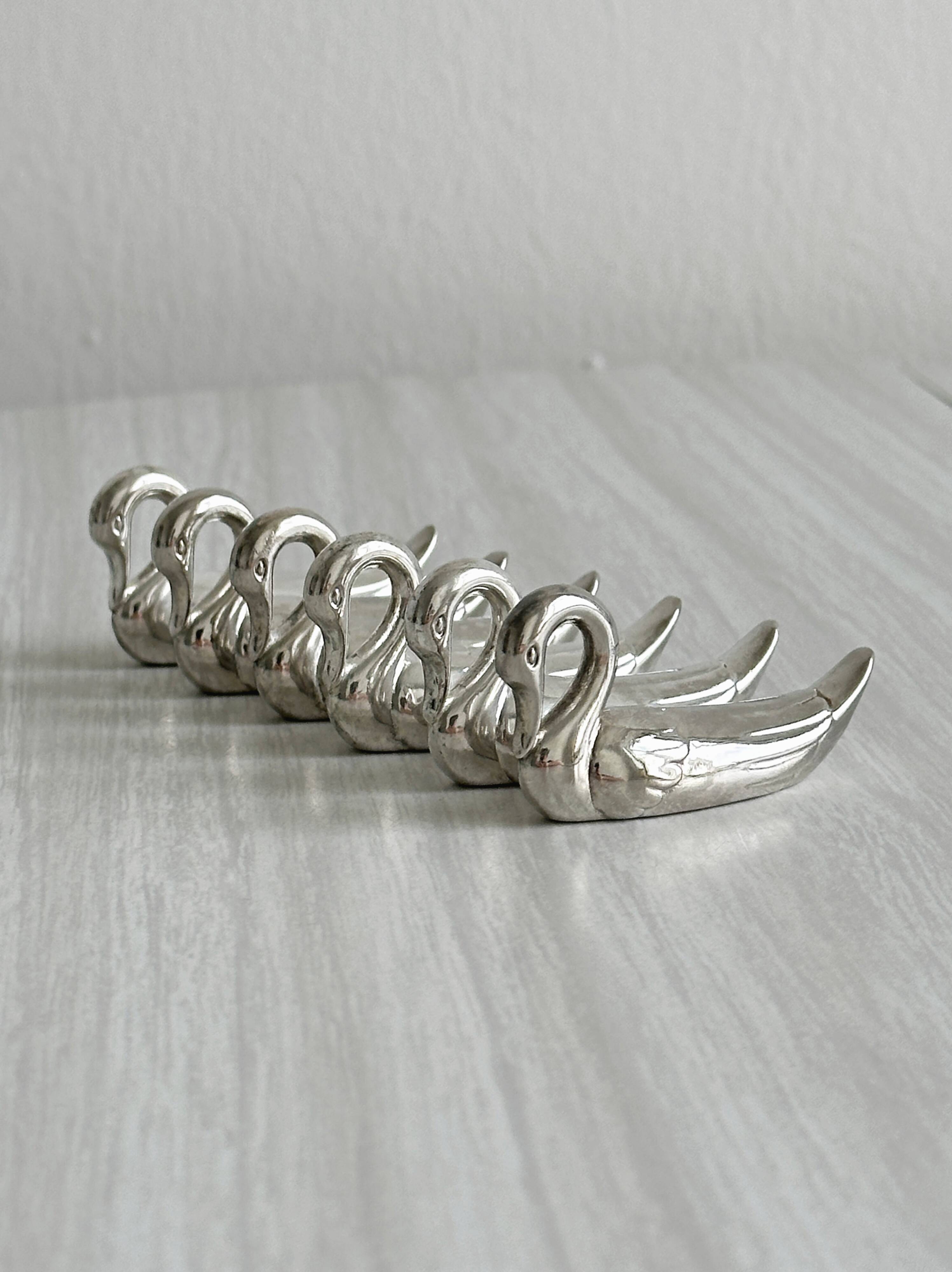 set of 6 metal knife holders in the shape of a swan,