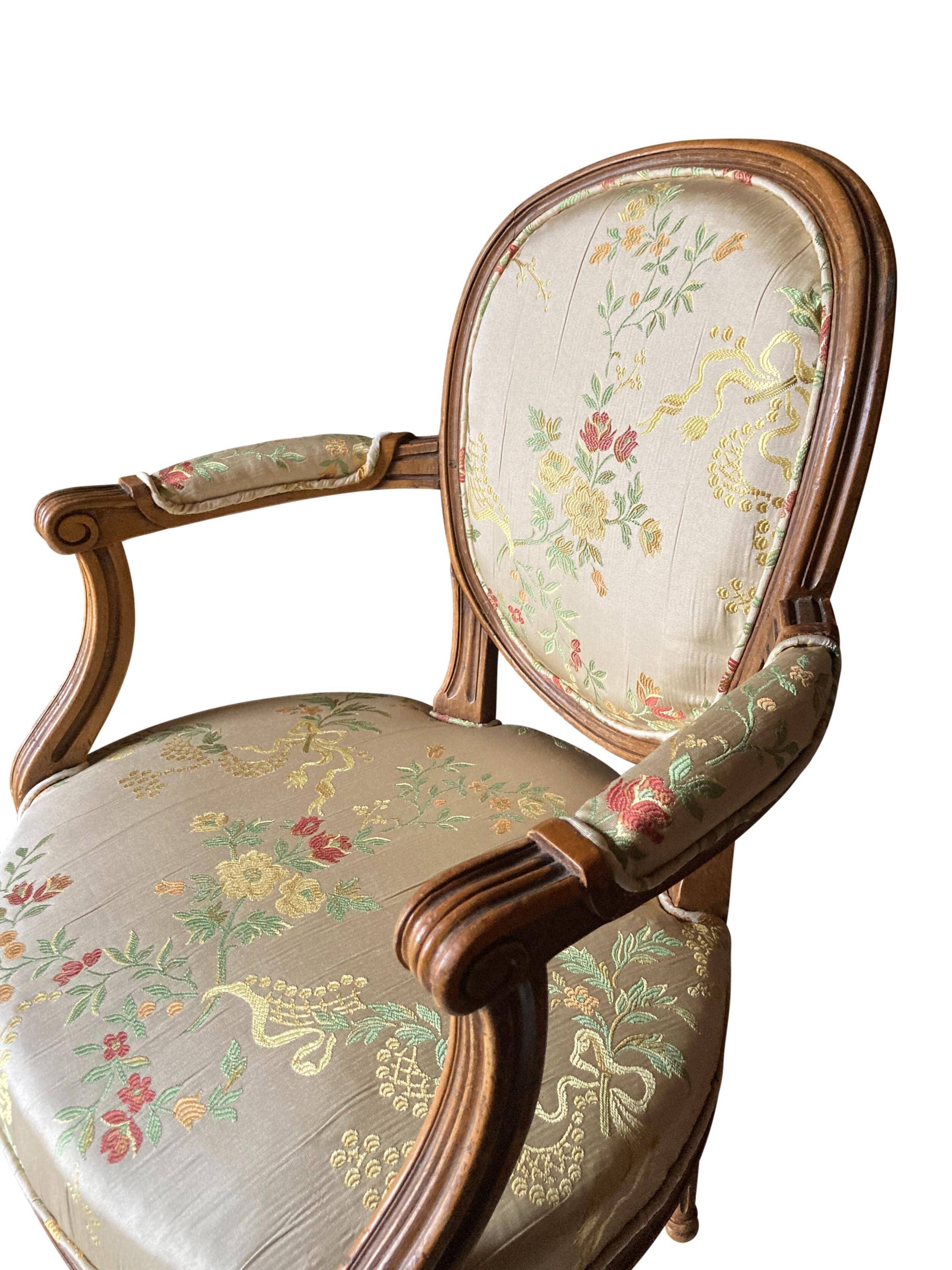 Pair of Louis XVI silk cabriolet armchairs