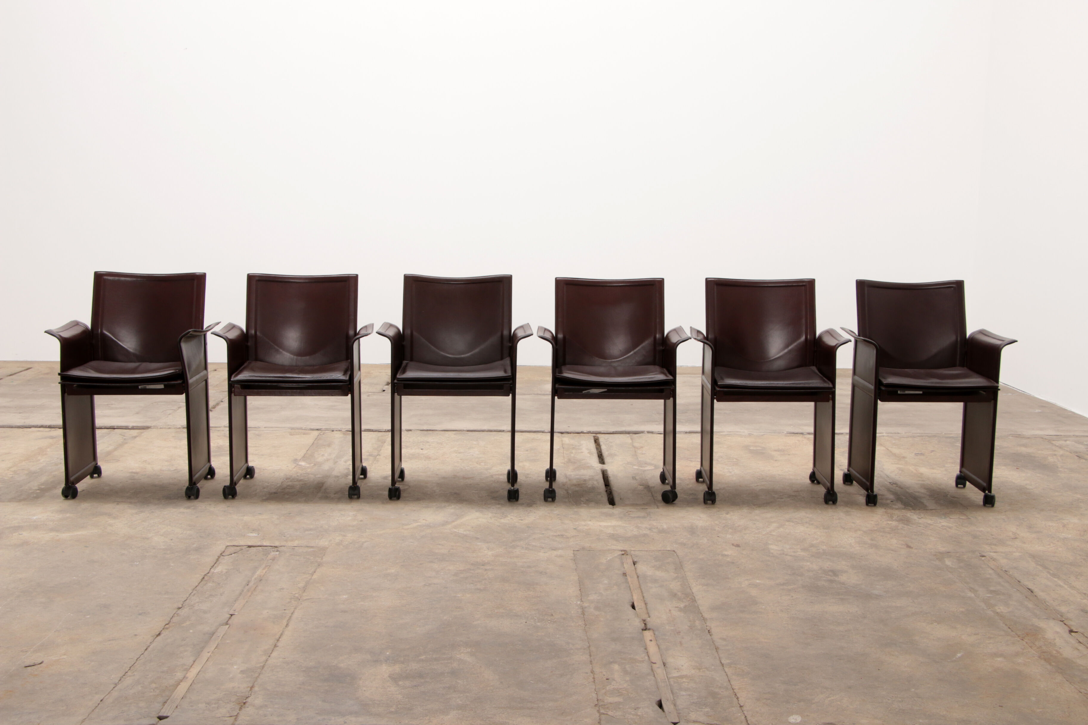 Tito Agnoli for Matteo Grassi leather dining table and six chairs