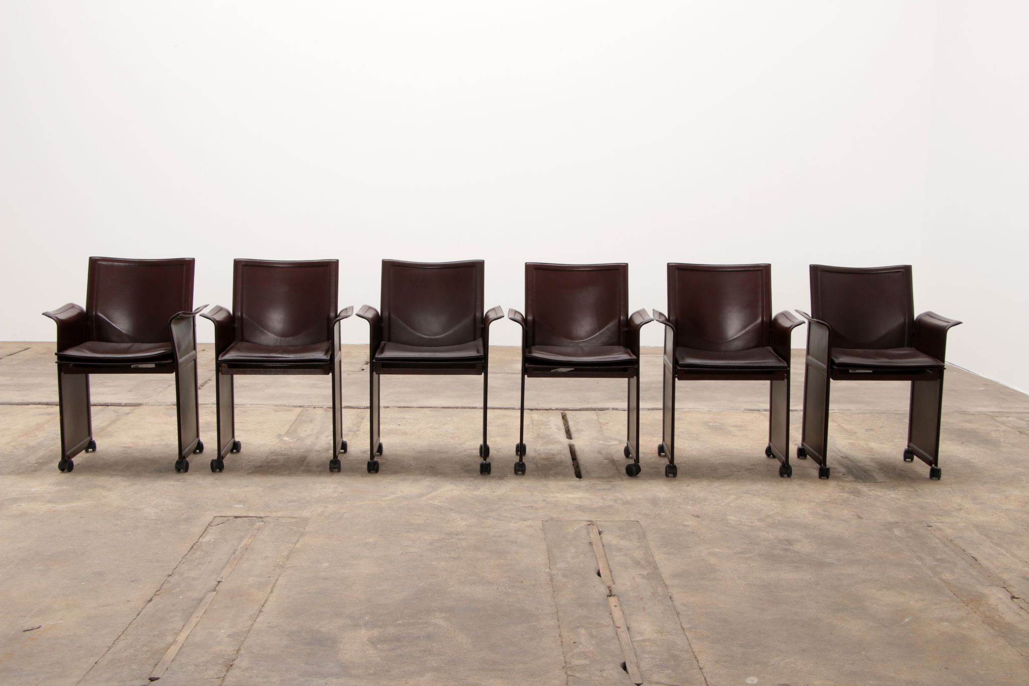 Tito Agnoli for Matteo Grassi leather dining table and six chairs