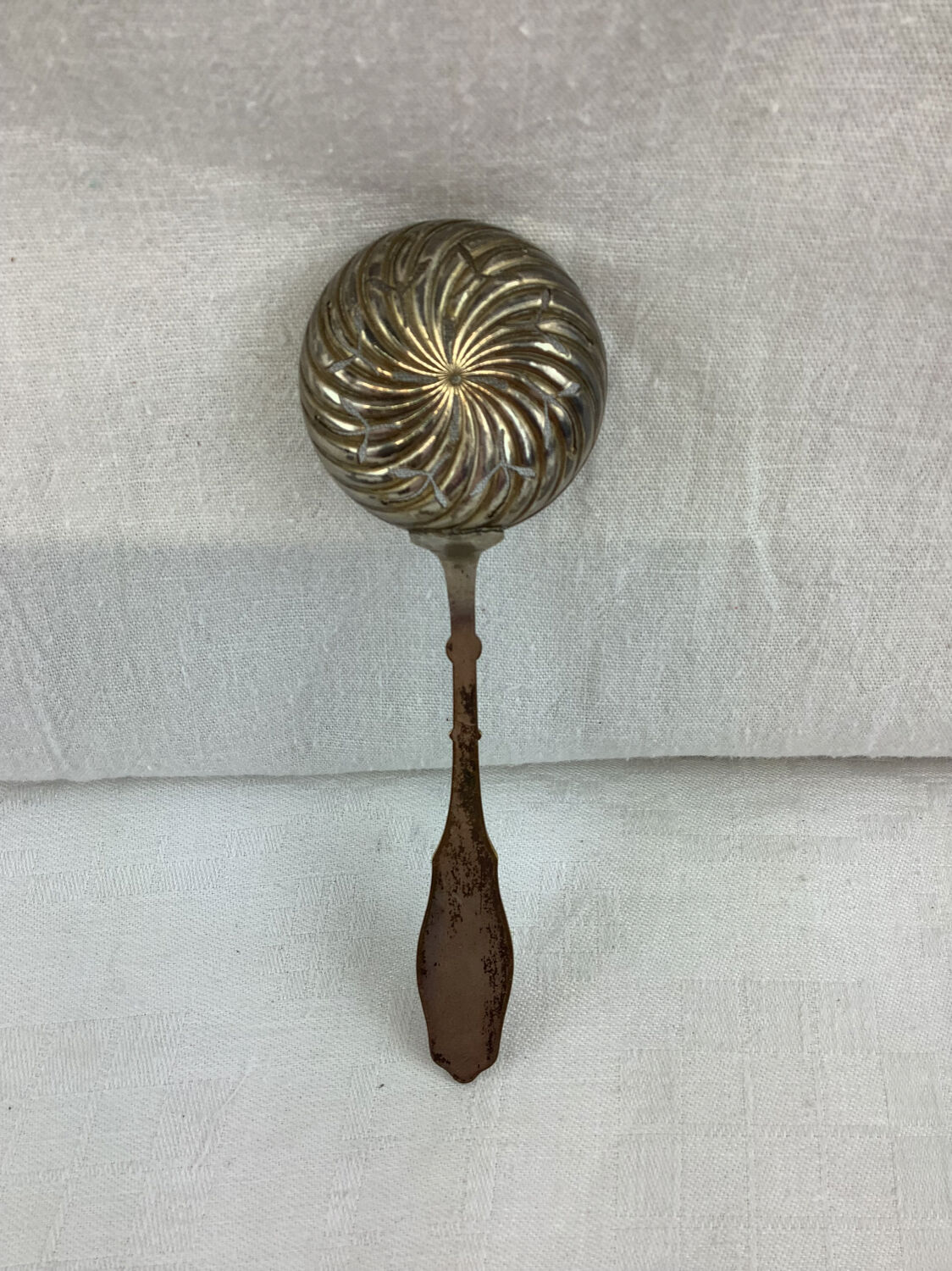 Old sprinkling spoon