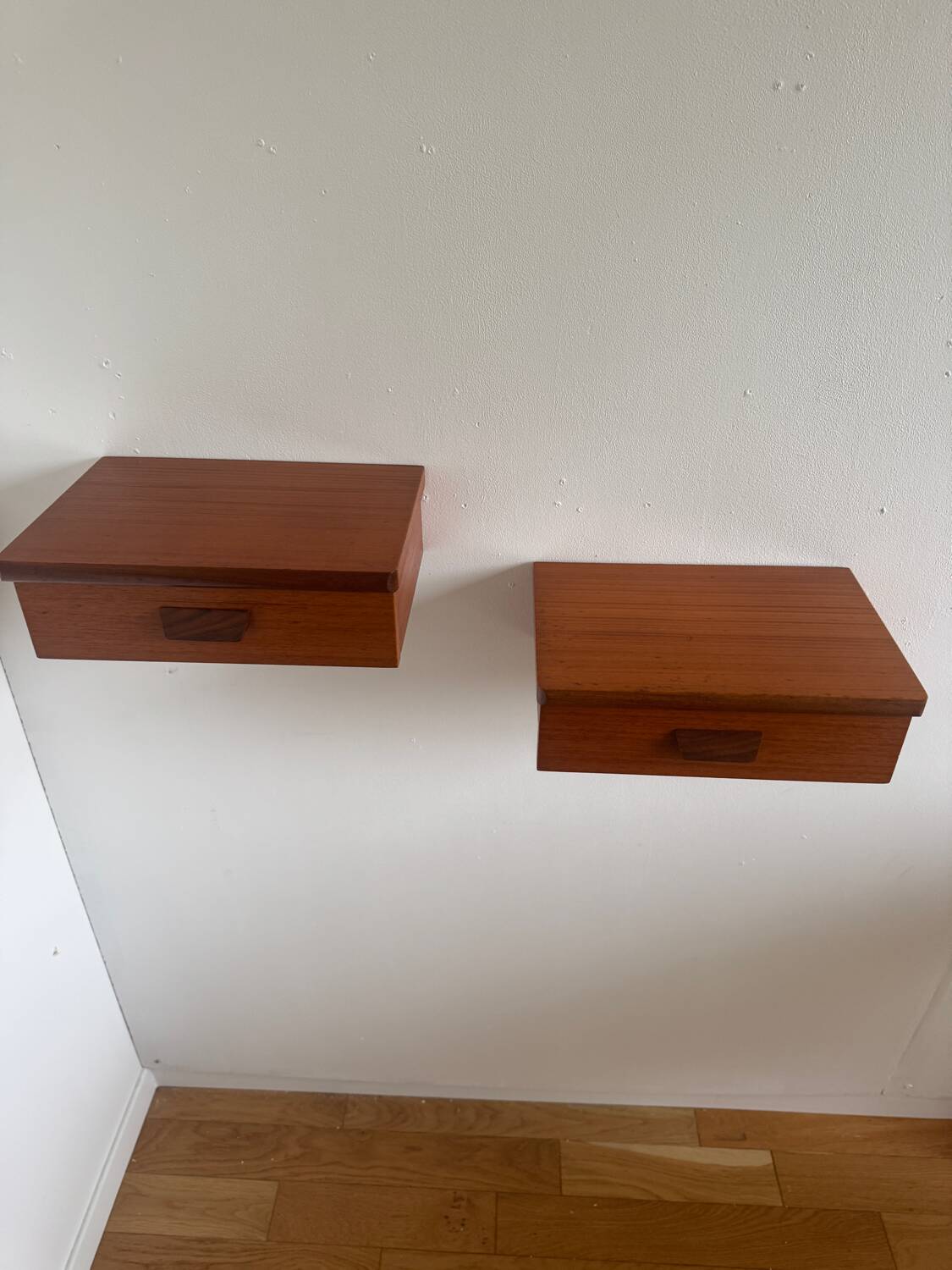 Vintage Scandinavian teak wall-mounted bedside tables.