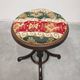 Antique curved wooden piano stool with kilim fabric from the 1910s.