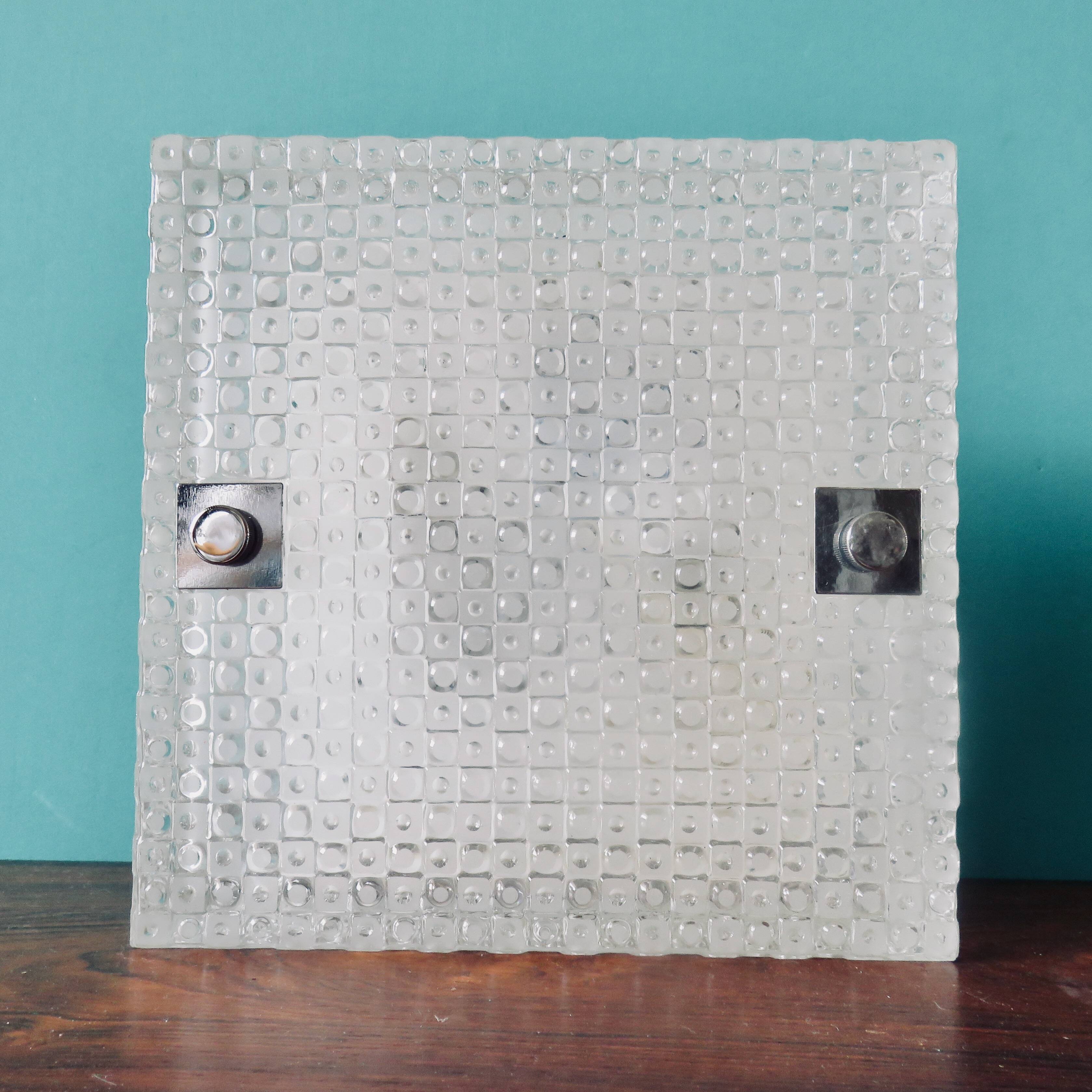 Pair of rectangular wall lights and square low relief glass wall lights. DVE Germany 1970