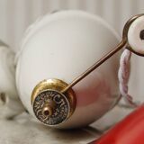 Enamelled sheet metal pendant rises & falls 1920