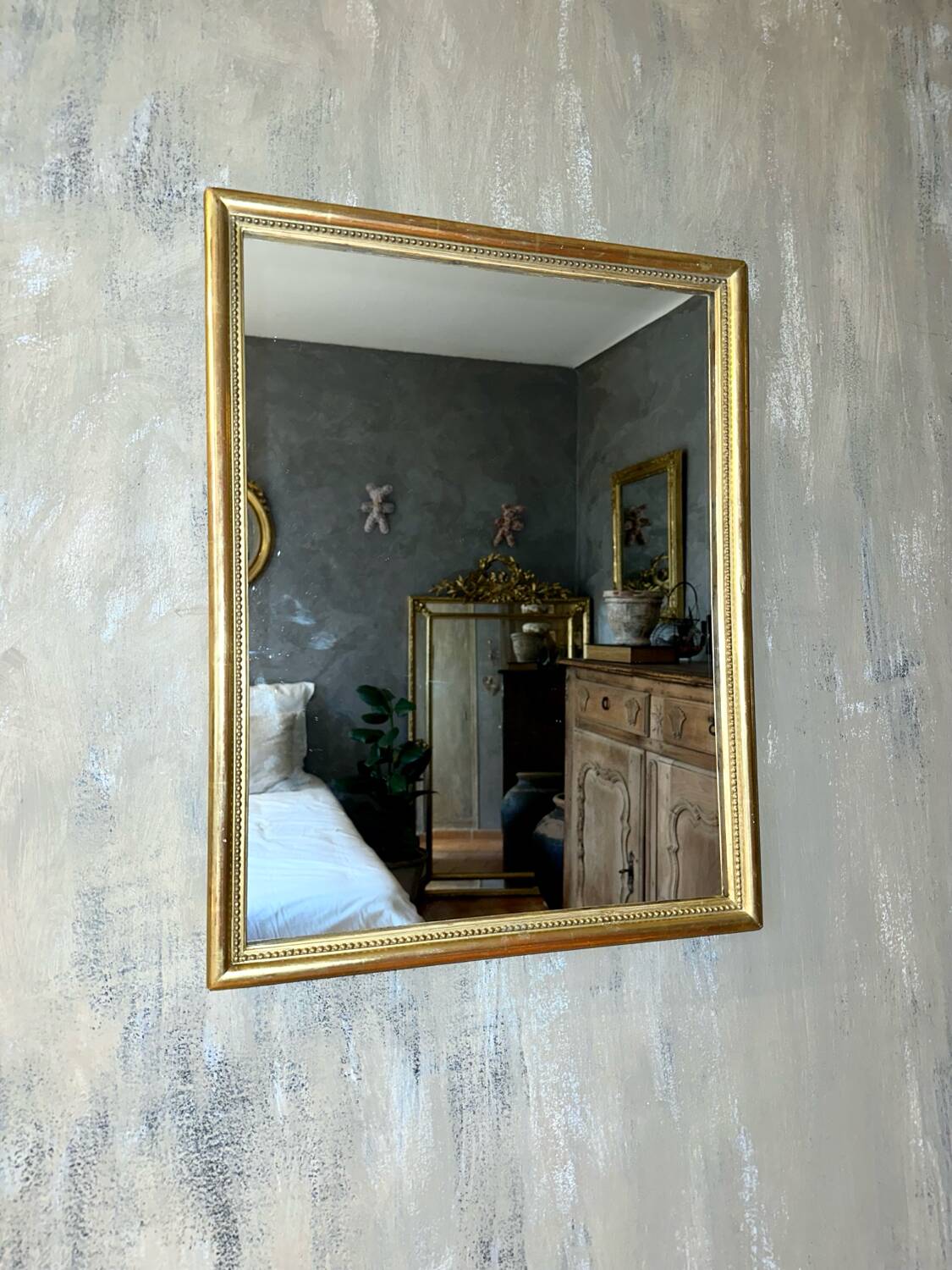 Antique beaded mirror with gold leaf