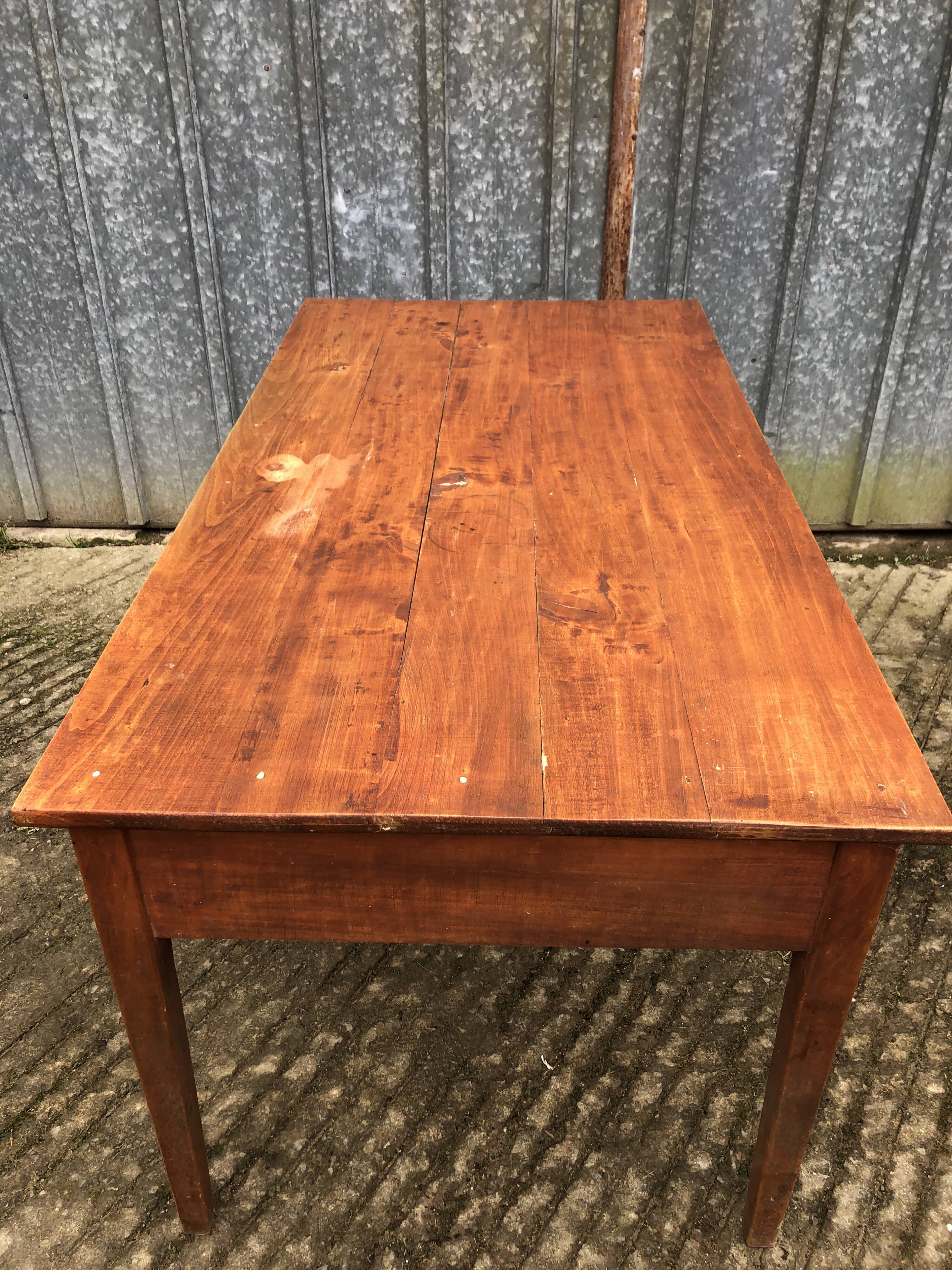 Poplar wood table with 2 front drawers from the Reconstruction period.