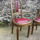 Pair of studded burgundy leather Art Deco chairs