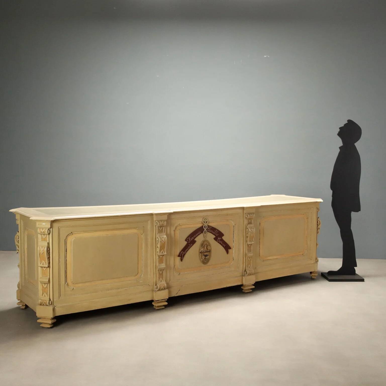 Antique pharmacy counter in lacquered walnut, Italy, late 19th century.