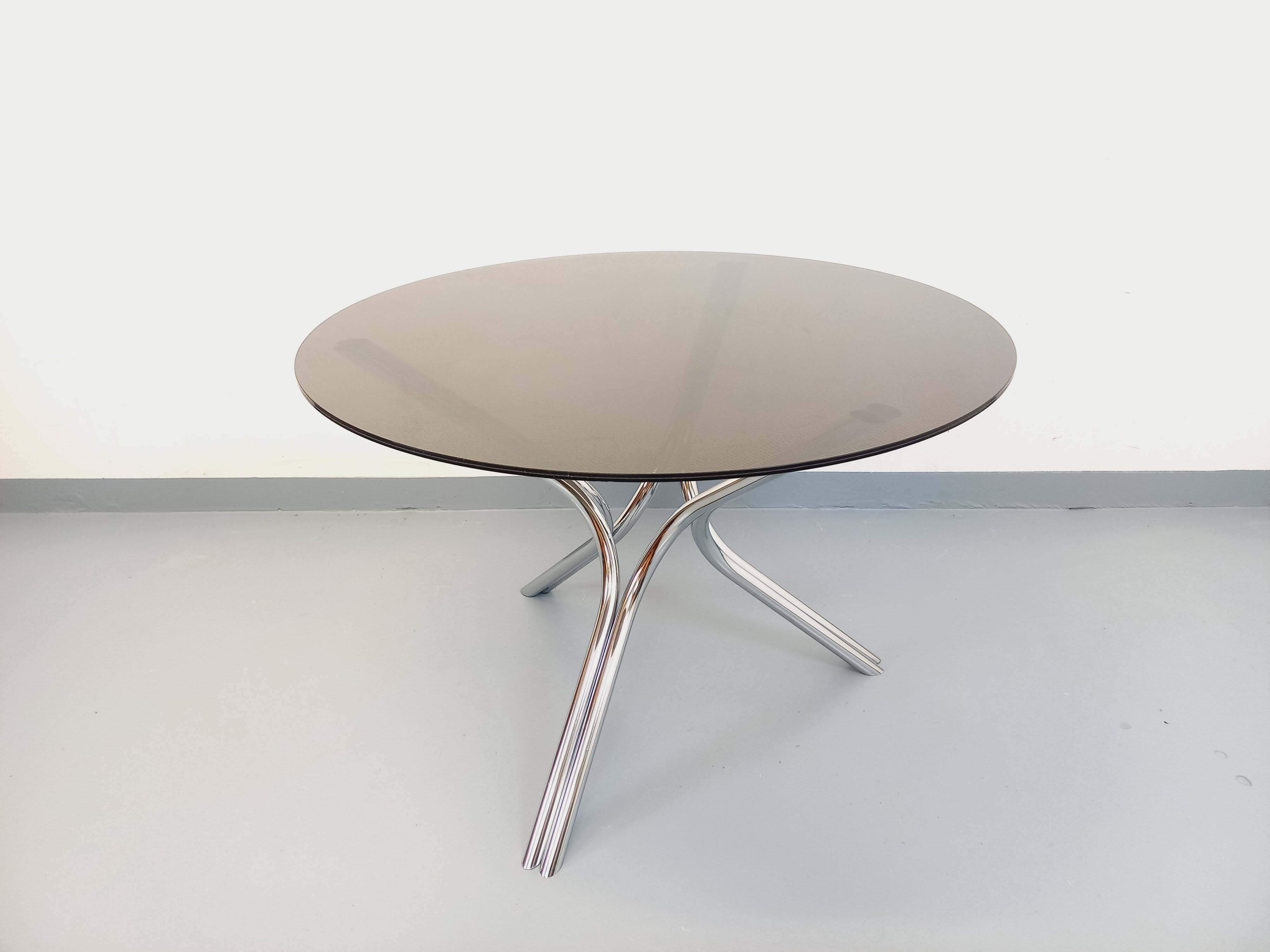 Vintage dining table in smoked glass plexiglass and chrome metal.