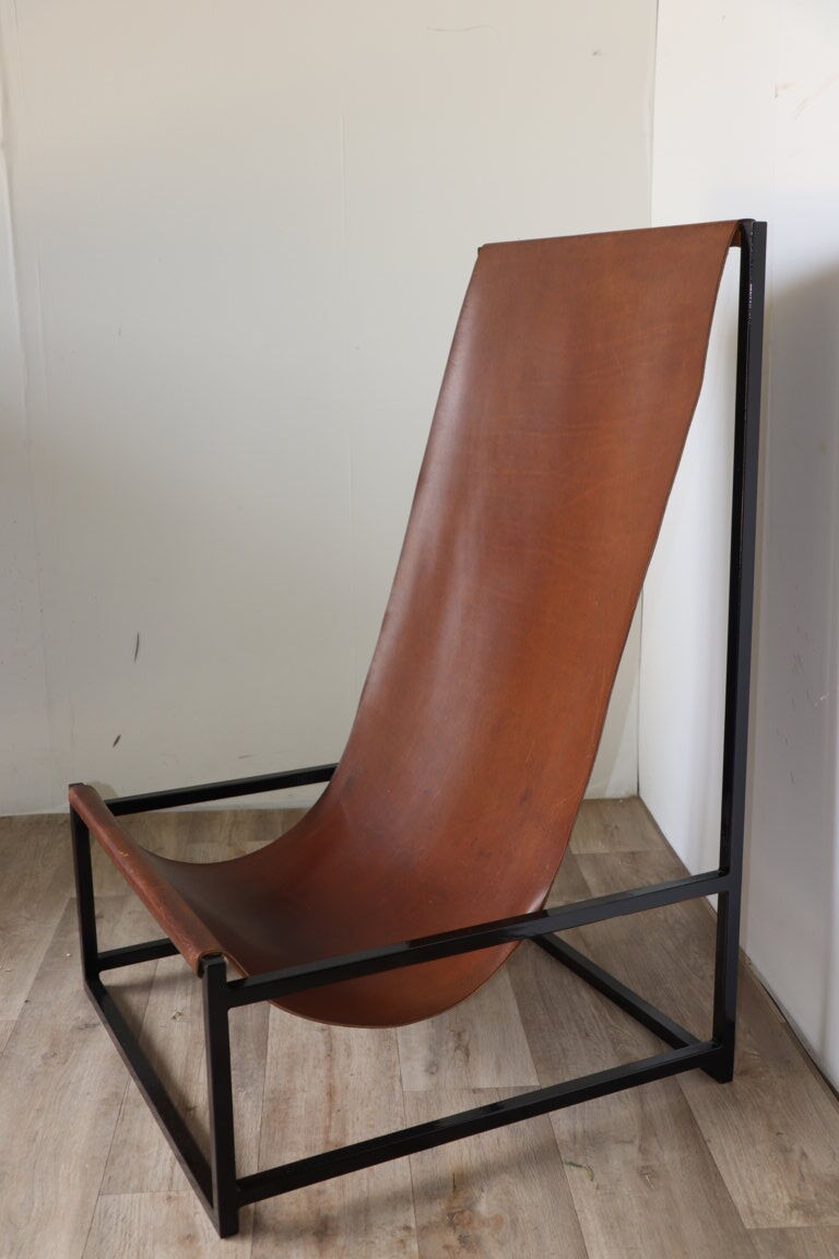 Pair of vintage armchairs in stretched leather and metal structure