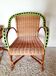 1950s 60s rattan armchair with green apple and black piping.
