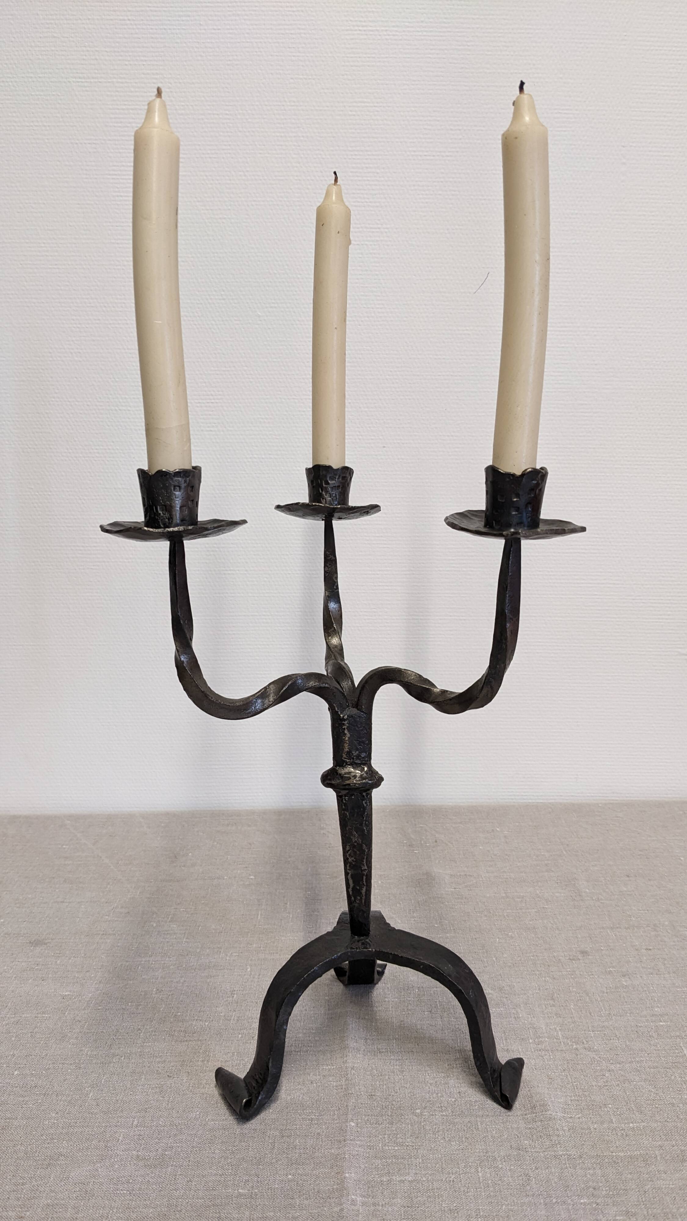 Brutalist candelabrum with 3 lights in wrought iron, France circa 1950.