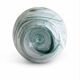 Blown glass vase marbled in white, water green, and with golden inclusions –