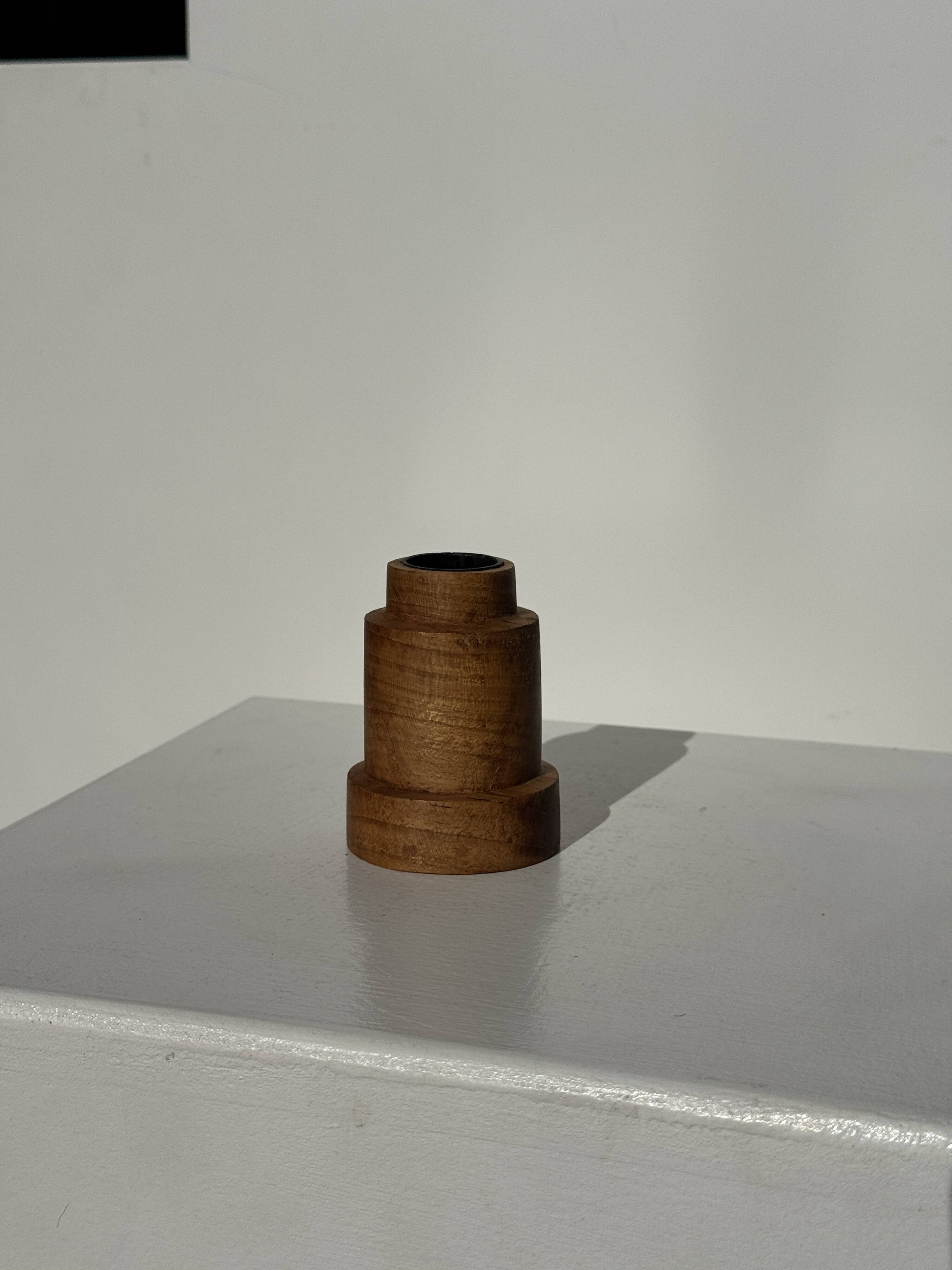 Circular teak monoxyle candlestick, pyramidal with a high central part H7 D5.