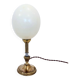 Ostrich egg lamp on a brass stand, antique curiosity cabinet.