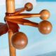 Minimalist organic coat rack in pine from the 1970s in space age style.